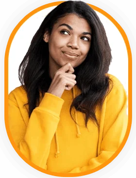 A woman in a yellow sweatshirt smiling brightly.